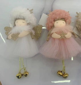 Detailed view of handmade Christmas angel dolls with tulle skirts and golden glitter wings