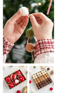 Close-up of handmade wool felt Christmas balls with snowflake embroidery in a gift box