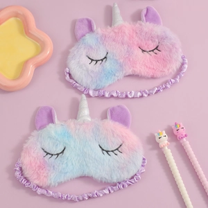 Close-up of rainbow plush unicorn sleep mask with soft elastic silk pleated headband
