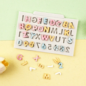 Detail of alphabet and number silicone mold with colorful DIY fondant letters and digits
