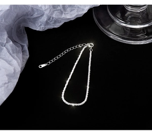Detailed close-up of S925 sterling silver chain with heart charm and lobster clasp