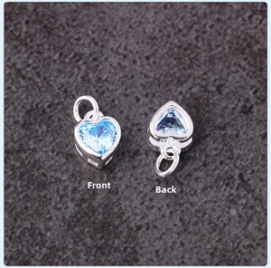 Front and back detail of S925 silver heart pendant with micro-set sky blue zircon stone