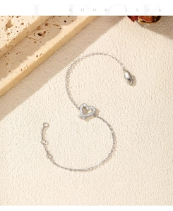 Macro view of S925 sterling silver heart bracelet with VVS1 moissanite stones