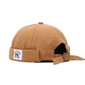 Retro caramel docker cap with Brooklyn patch and adjustable metal buckle on back