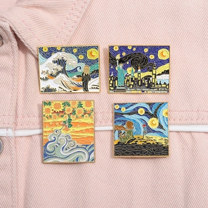 Artistic enamel pins set with oil painting designs on light pink denim fabric