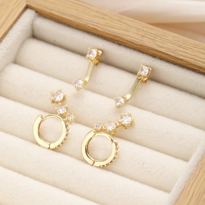Elegant set of 3 gold copper earrings with sparkling zircon stones in a jewelry box