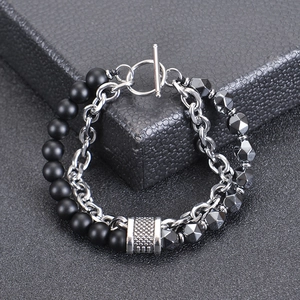 Detail of double-layer men's bracelet with matte black beads and OT toggle closure