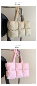 Detail view of quilted down tote bag showing khaki and pink padded lattice texture