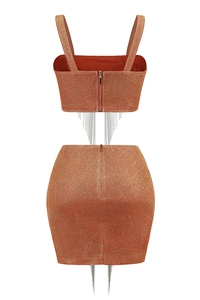 Detail view of the back zipper and metal chain fringe on a bronze glitter skirt set
