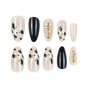 Almond cow print press-on nails with 3D gold metallic liquid design in 10-piece set