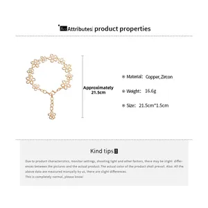 Detail view of gold floral bracelet with zircon inlay and product size specifications