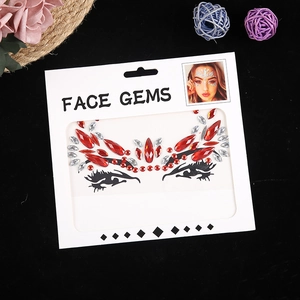 Red and silver rhinestone face gems for Halloween makeup decoration on black background
