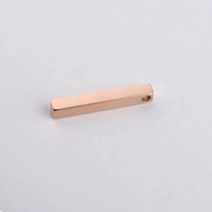 Macro view of 3D rose gold stainless steel bar pendant with hole for custom DIY engraving