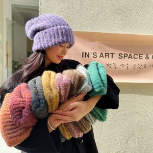 Detail of thick knit beanie with soft mohair texture in various vibrant autumn colors