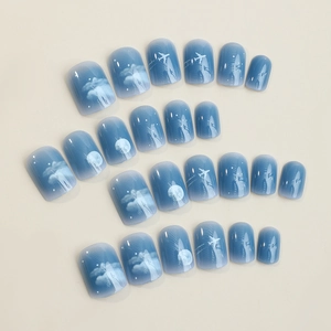 Short square press on nails with night sky gradient design featuring clouds and moon