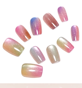 Detailed view of rainbow cat-eye press-on nails in colorful gradient shimmer finish