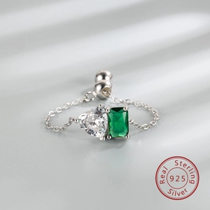 Detail of S925 sterling silver chain ring with green square and clear heart zircon stones