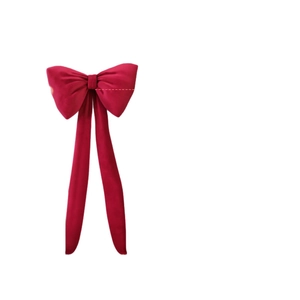 Large red velvet decorative bow with long ribbons for wedding and party backdrop decoration