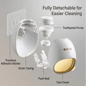Wall-mounted automatic toothpaste dispenser with detachable components and golden trim