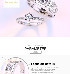 Detailed view of silver couple rings set with six-prong round zircon and Greek pattern