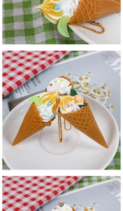 Close-up of realistic ice cream cone pendant with cream and gold bead chain accessory