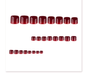 Set of 24 solid dark red glossy press-on toenails neatly arranged on a white background