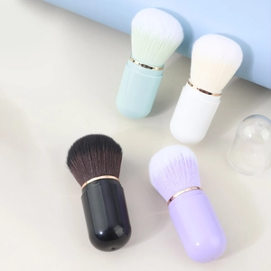 Portable capsule retractable makeup brushes in mint, white, black and purple with dust cover