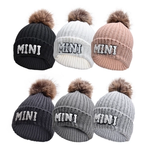 Winter knit hats with MINI embroidery and faux fur pom poms in six neutral colors