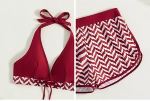 Detail of burgundy halter swim top and chevron print boyshorts bikini set fabric texture
