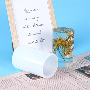 Detail of cylindrical silicone resin mold with a finished dried flower resin art piece