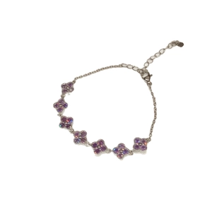 Elegant floral chain bracelet featuring purple zircon clover motifs on a silver finish