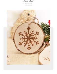 Close-up of a natural wood Christmas snowflake ornament with rustic jute rope hanging