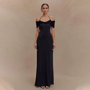 Detail of elegant black off-shoulder halter dress with mesh patchwork and backless design