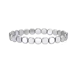Macro detail of minimalist silver metal disc beads on a beaded stretch bracelet