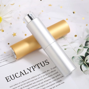 Portable twist-up aluminum perfume spray bottles in gold and silver matte finishes