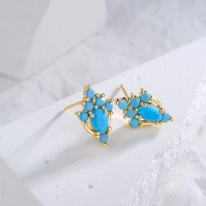 Luxury geometric gold-plated stud earrings featuring blue oval and round turquoise stones