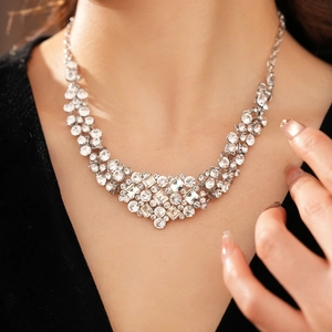 Close-up of sparkling rhinestone geometric necklace on model highlighting fine craftsmanship