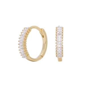 Detail view of gold hoop earrings featuring channel-set white baguette zircon stones