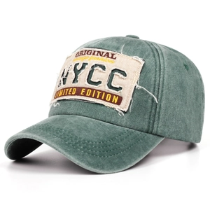 Close-up of vintage green washed cotton baseball cap with distressed embroidery detail