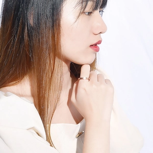 18k rose gold plated roman numeral ring with diamonds worn by an Asian female model