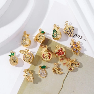 Close-up of 18K gold plated fruit pendants with micro-pave colored zircon stones