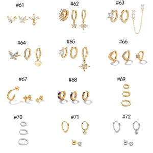 Detailed grid view of 12 gold and silver earring sets with sparkling zircon inlays