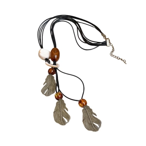 Bohemian multilayer beaded necklace with brown wood, resin beads and leaf pendants