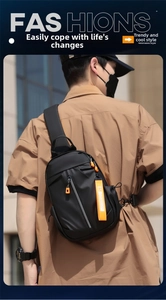 Detail of black nylon sling bag with orange zipper pull and fashion ribbon on model