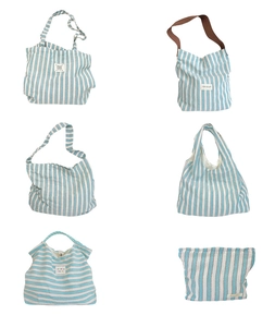 Collection of various blue striped canvas bags including shoulder bags and pouches