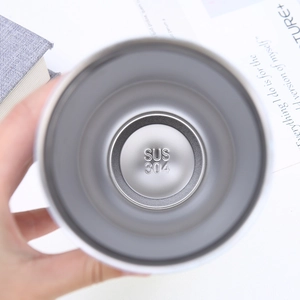 Detail shot of the SUS 304 food-grade stainless steel interior stamp at the bottom of the cup