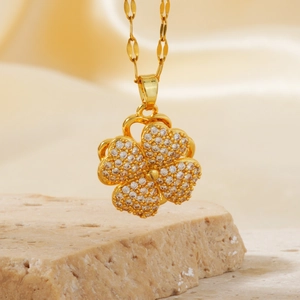 Exquisite gold clover pendant necklace with micro-pave crystals on stone base