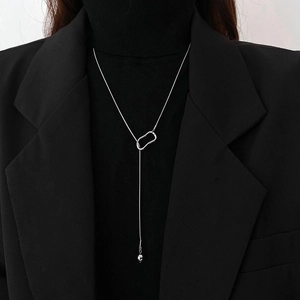 Minimalist silver bead sweater chain necklace featuring a geometric Y-shaped tassel pendant