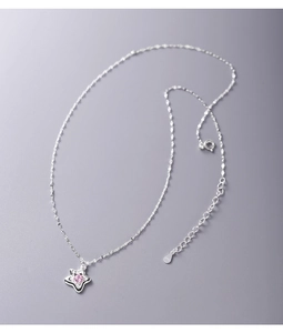 Detailed view of S925 silver star pendant necklace with pink zircon on blue background
