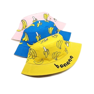 Kids cotton banana print bucket hats in pink, blue, and yellow for sun protection